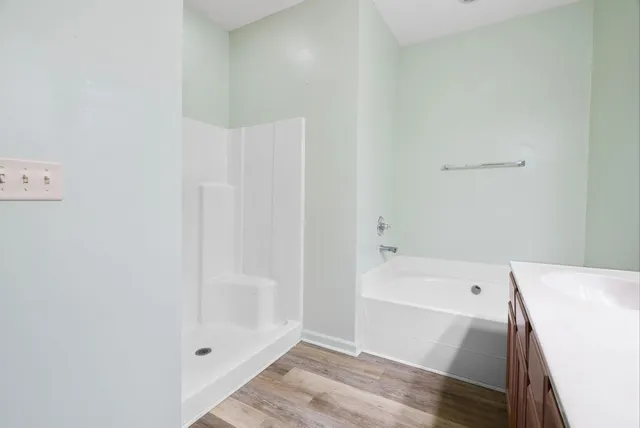a bathroom with a bathtub and shower