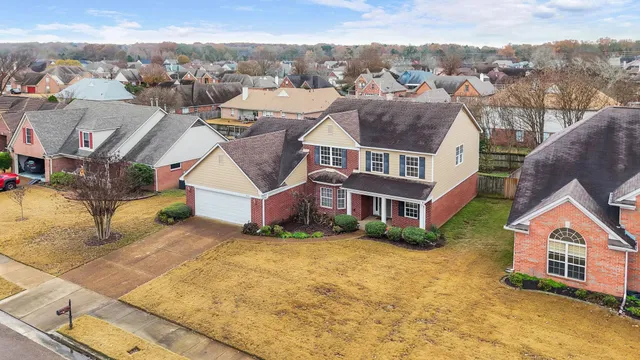 a view of a yard with a street sign