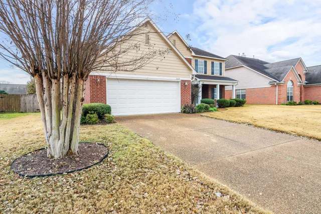 a aerial view of a house with a yard