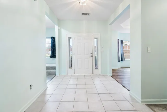a view of an empty room and window