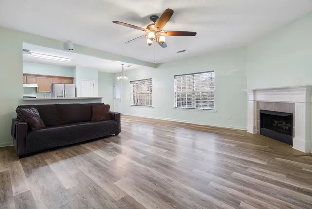 a living room with furniture and a fireplace