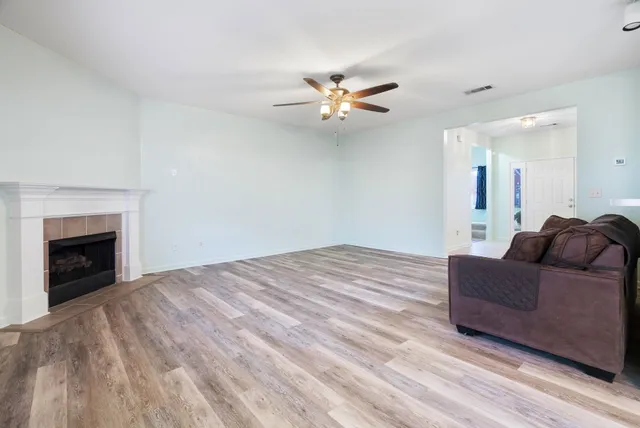 a living room with a couch and a fireplace