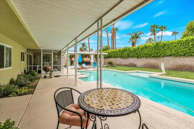 a kitchen with stainless steel appliances a sink stove and cabinets