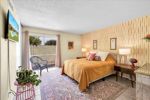 a bathroom with a sink a mirror and shower