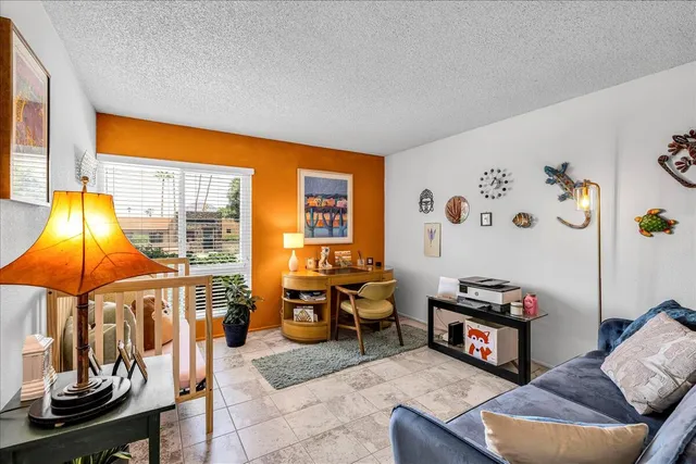 a living room with furniture and a table