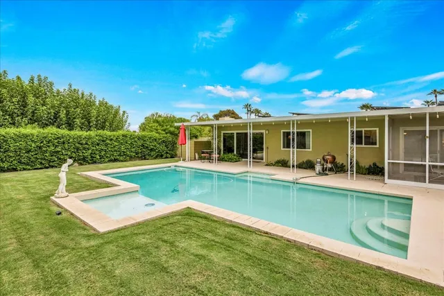 a view of a porch with furniture and a potted plant