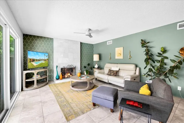 a living room with furniture and a lamp