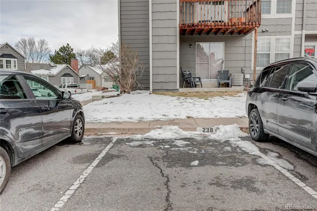 a view of a car park in front of a house