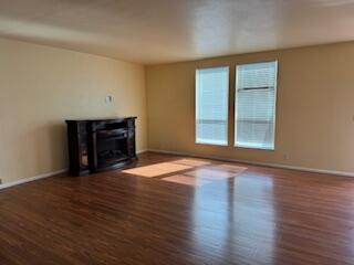 355 Colver Road, Unit 24 Talent, OR 97540 - Photo 5 of 21 a view of an empty room with wooden floor and a window