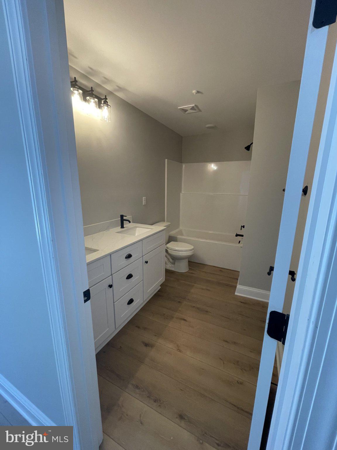 510 Talbot Road Stevensville, MD 21666 - Photo 23 of 31 Upper hall bath double vanity & tub shower combo.
