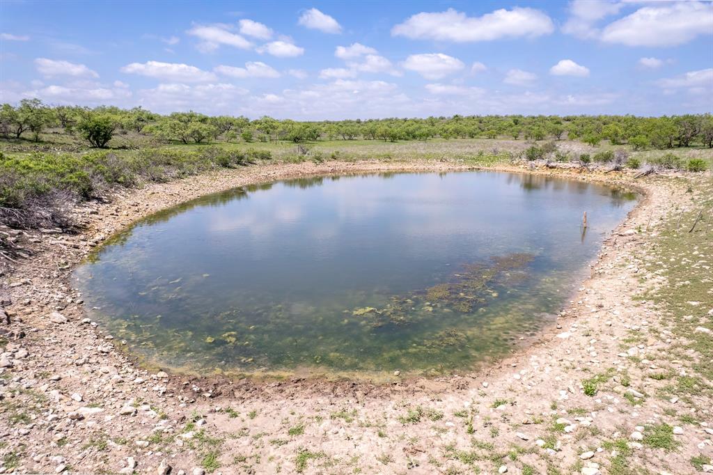 821 P R 4901 Goldsboro, TX 79519 - Photo 6 of 28 a view of a lake with a mountain