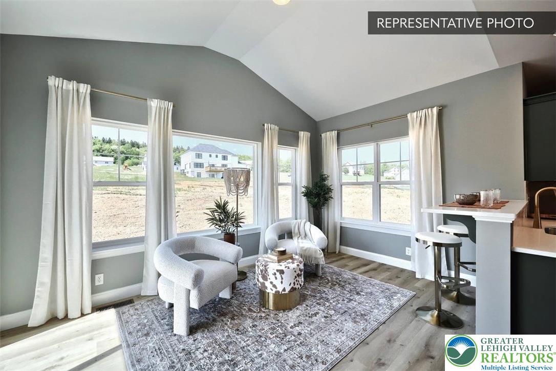 2010 Settlers Ridge Road, Unit LOT 4 Slatington, PA 18080 - Photo 12 of 20 a living room with furniture and a flat screen tv
