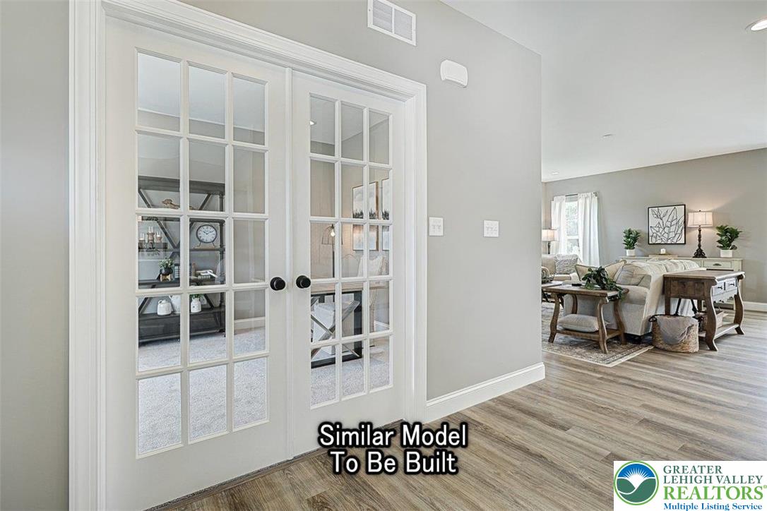 2010 Settlers Ridge Road, Unit LOT 4 Slatington, PA 18080 - Photo 4 of 20 a view of a living room and dining room with wooden floor