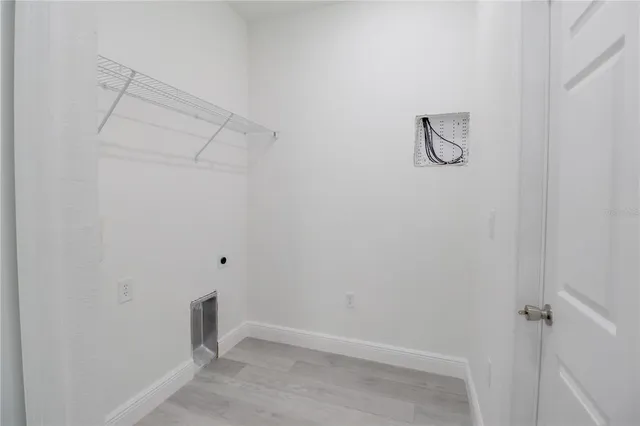 a view of a storage & utility room with racks on the wall