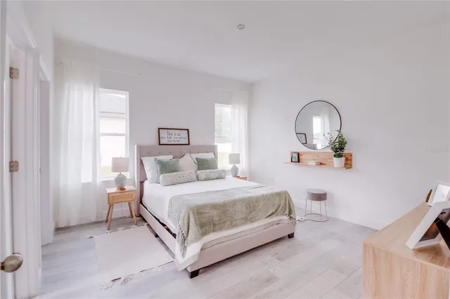 a bedroom with a bed and a dresser