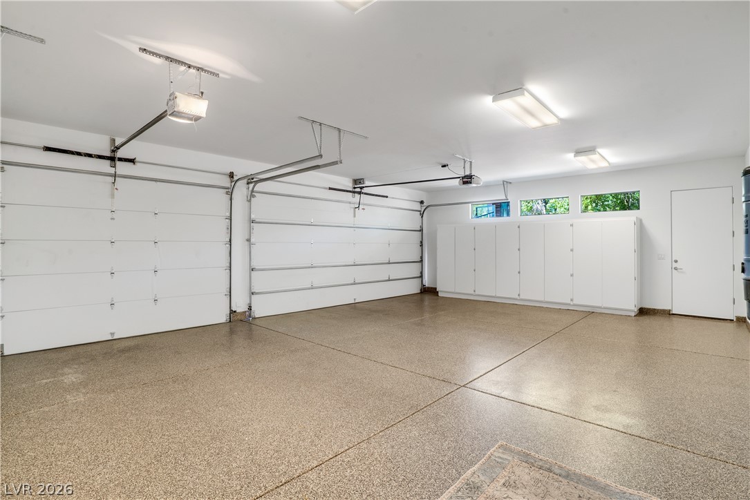 10 Ridge Blossom Road Las Vegas, NV 89135 - Photo 58 of 64 Garage featuring a garage door opener