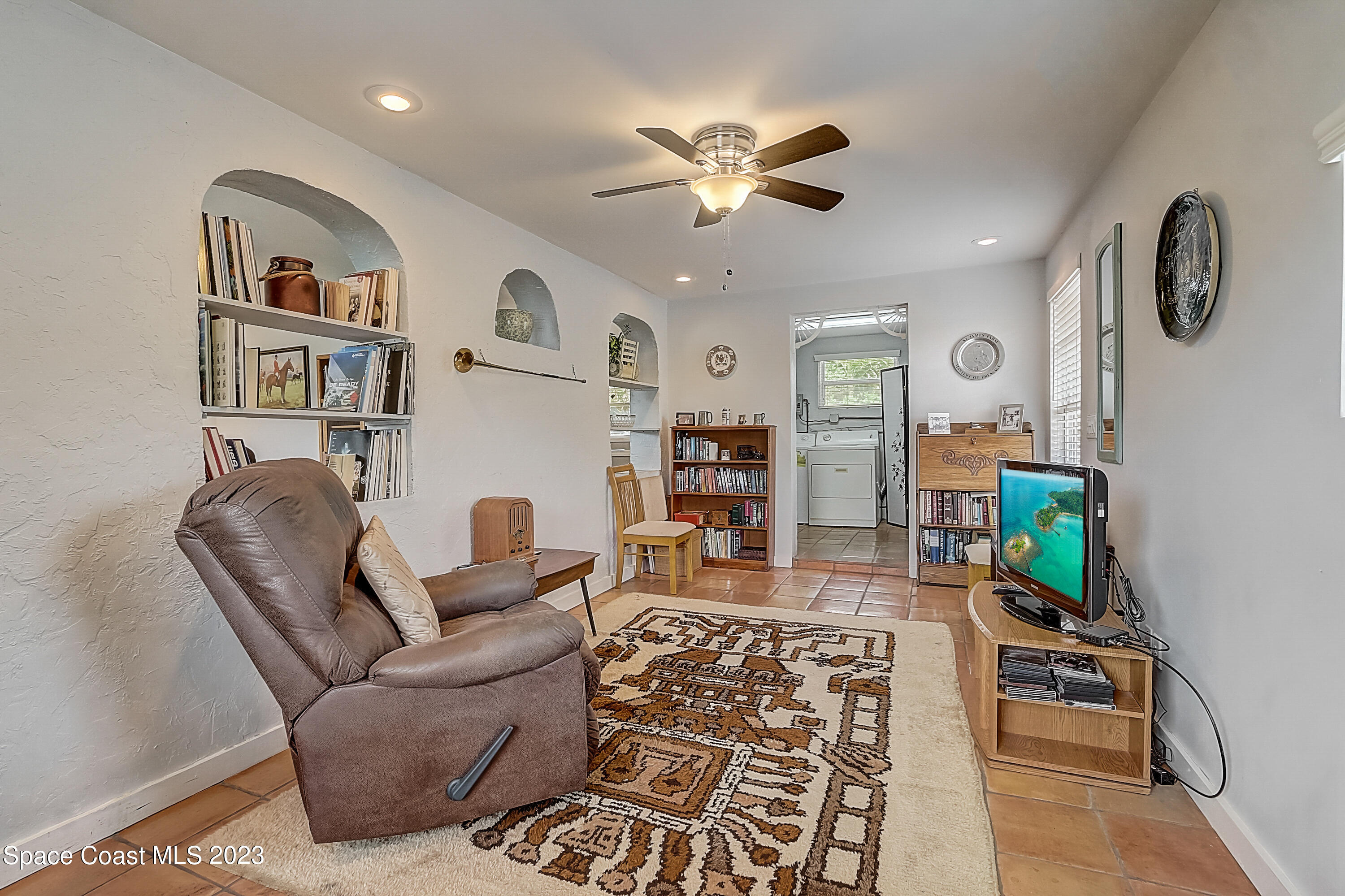 201 Cherry Street Melbourne, FL 32901 - Photo 11 of 22 a living room with furniture and a flat screen tv
