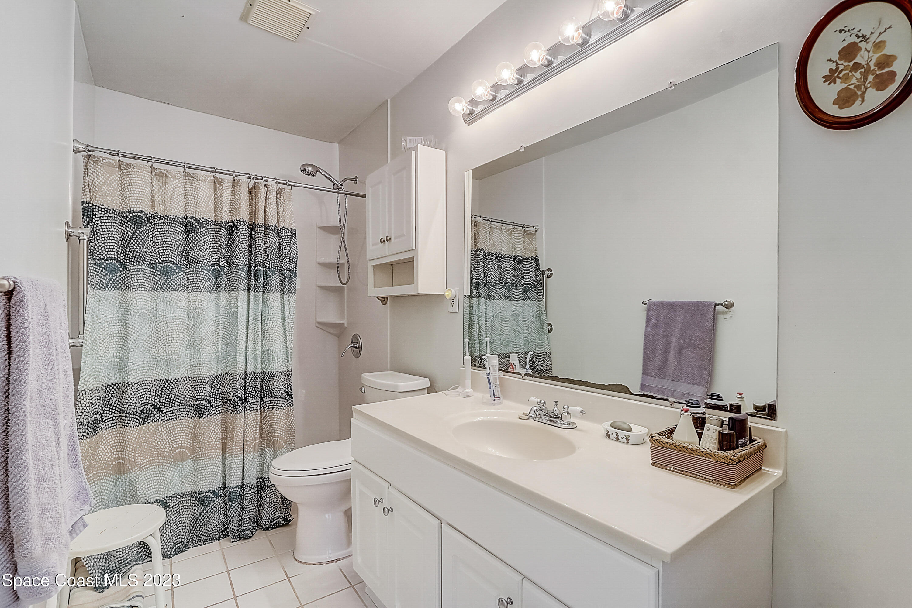 201 Cherry Street Melbourne, FL 32901 - Photo 12 of 22 a bathroom with a sink toilet and shower