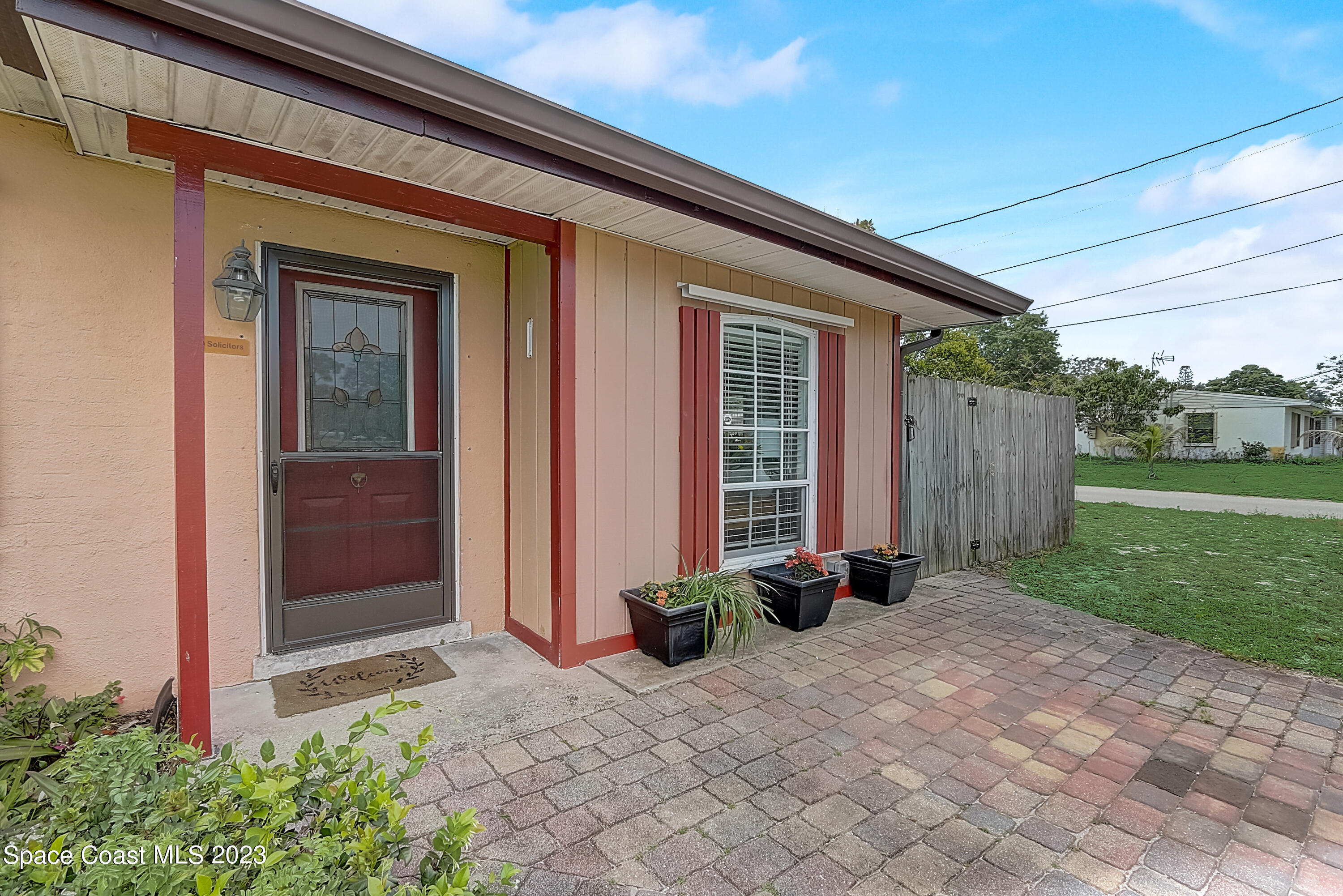 201 Cherry Street Melbourne, FL 32901 - Photo 2 of 22 a front view of house with a garden