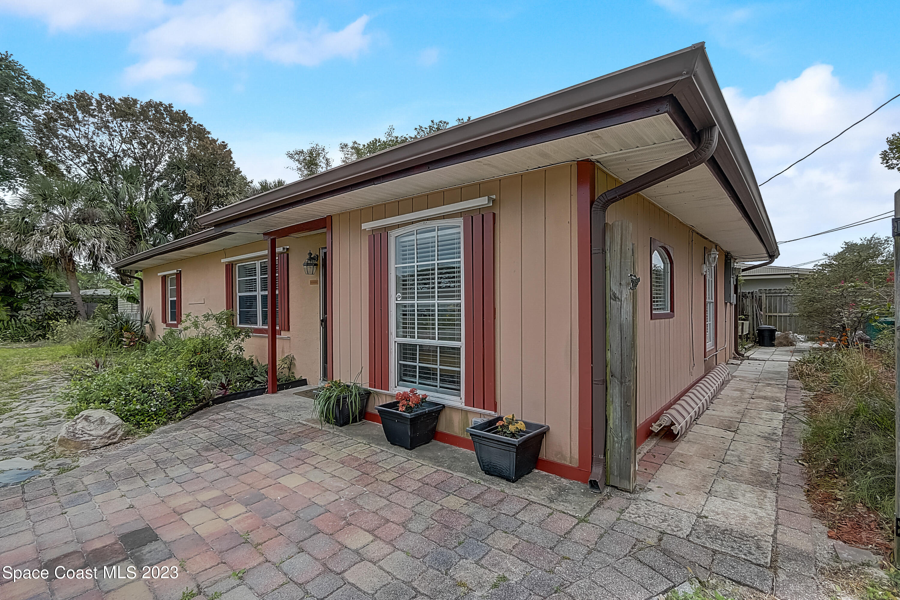 201 Cherry Street Melbourne, FL 32901 - Photo 3 of 22 a view of a house with backyard and garden