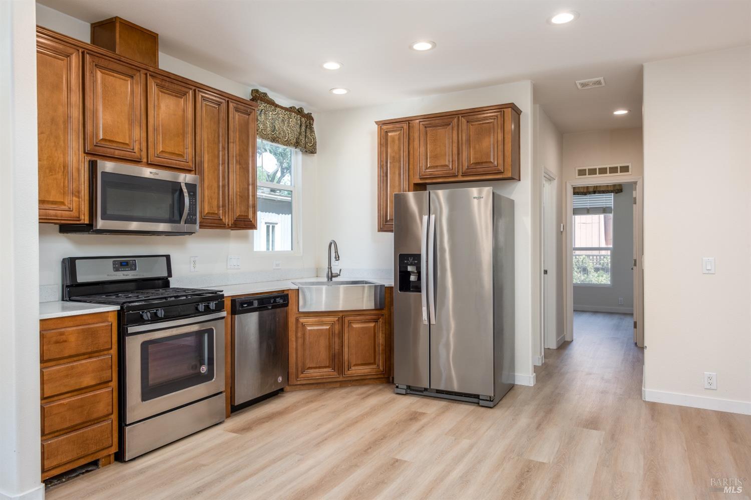 9 Larkspur Place Santa Rosa, CA 95409 - Photo 1 of 1 a kitchen with stainless steel appliances granite countertop a refrigerator stove and microwave