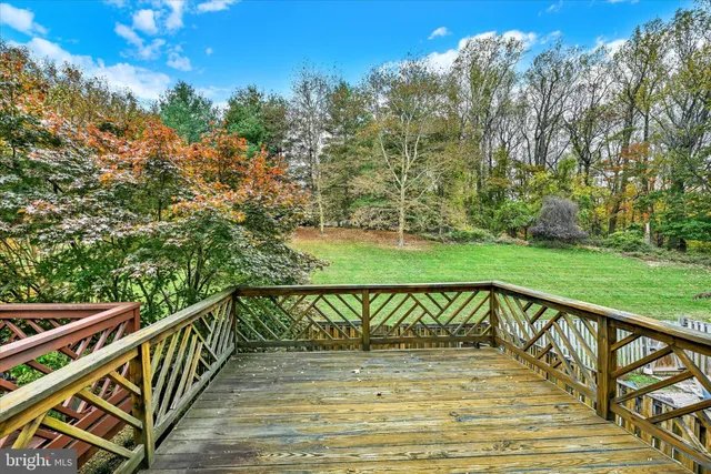 a view of a balcony with yard