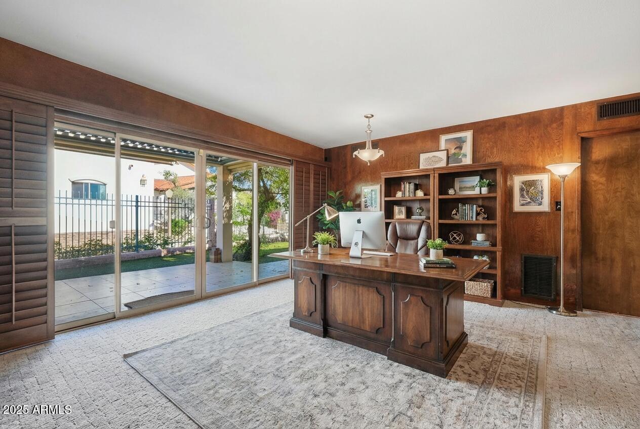 2131 East Bethany Home Road Phoenix, AZ 85016 - Photo 12 of 54 a room with stainless steel appliances granite countertop a refrigerator and wooden cabinets