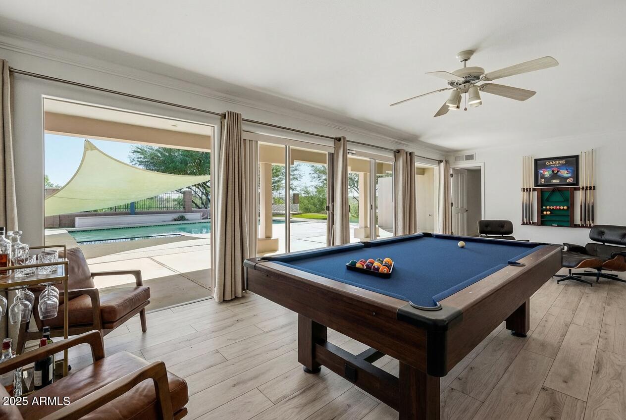 2131 East Bethany Home Road Phoenix, AZ 85016 - Photo 20 of 54 a living room with furniture pool table and a floor to ceiling window