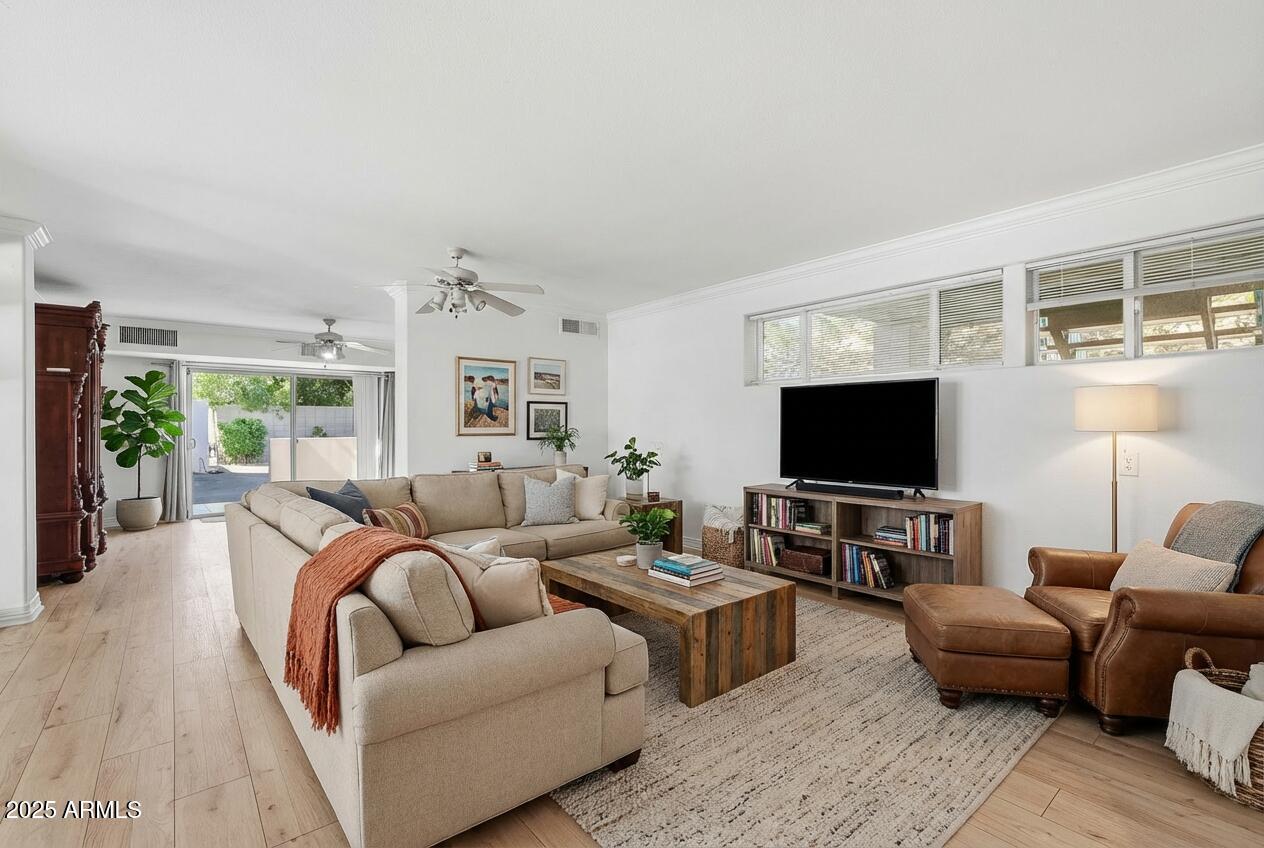 2131 East Bethany Home Road Phoenix, AZ 85016 - Photo 22 of 54 a living room with furniture and a flat screen tv