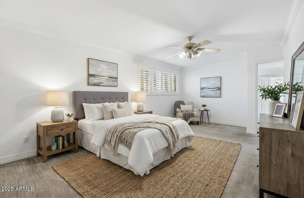 2131 East Bethany Home Road Phoenix, AZ 85016 - Photo 24 of 54 a spacious bedroom with a bed and a couch