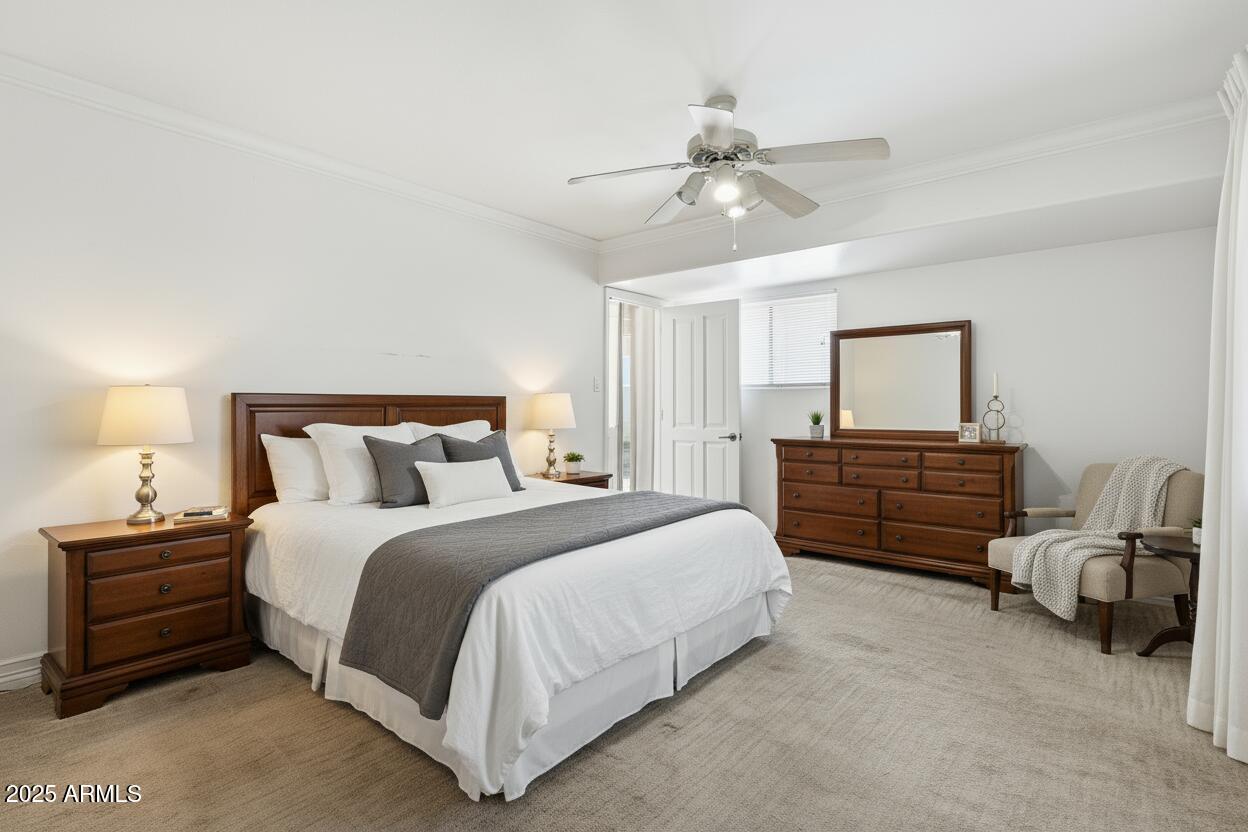 2131 East Bethany Home Road Phoenix, AZ 85016 - Photo 27 of 54 a spacious bedroom with a bed and a chandelier