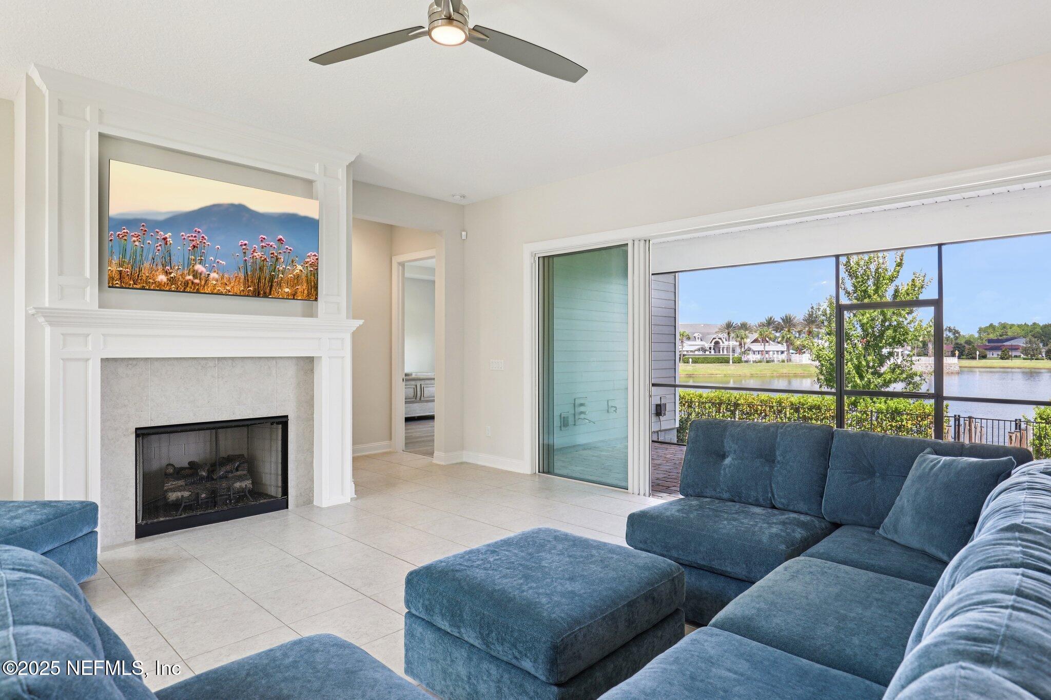 194 Snowbell Court St. Augustine, FL 32095 - Photo 20 of 89 a living room with furniture and a fireplace