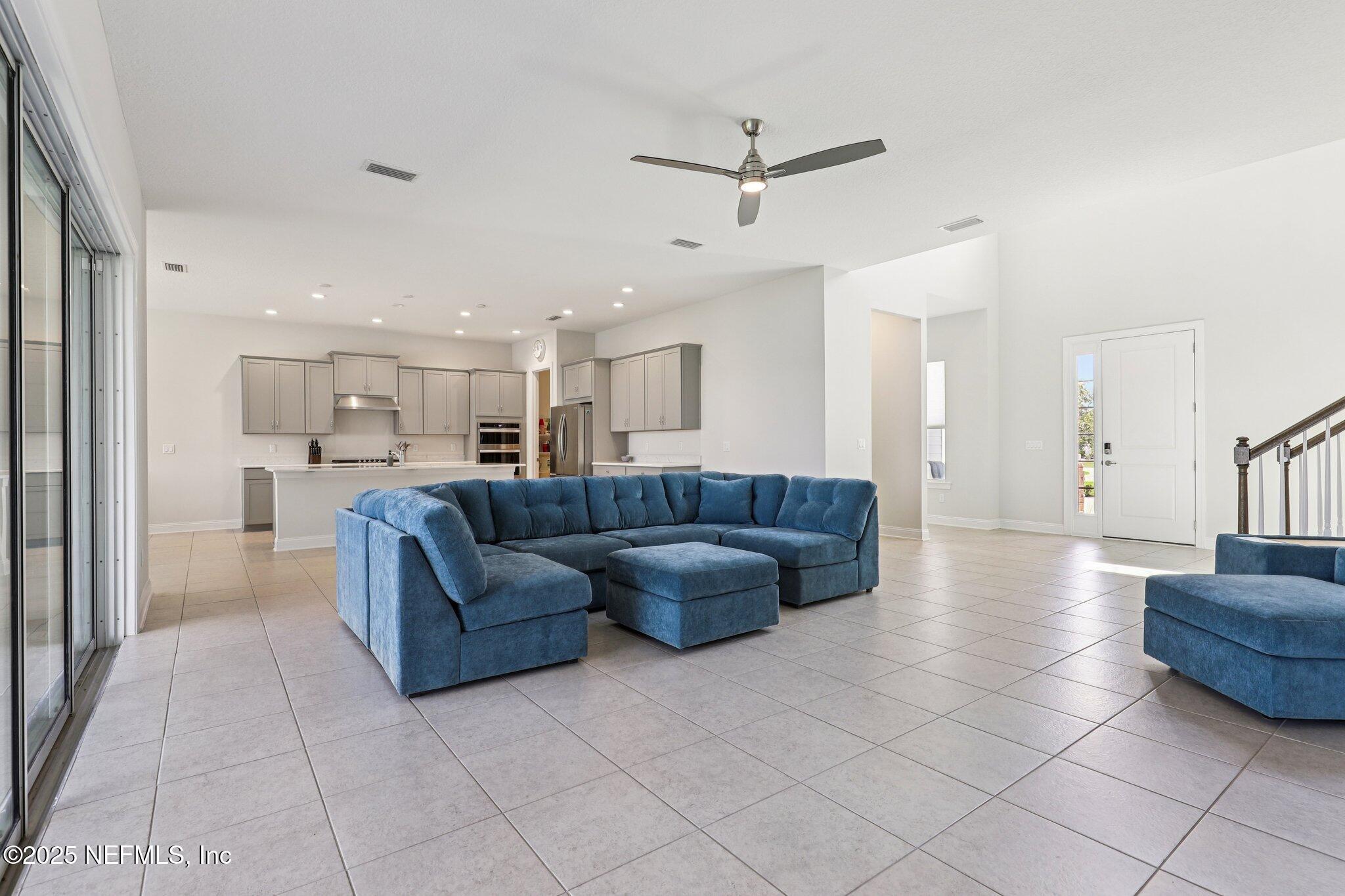 194 Snowbell Court St. Augustine, FL 32095 - Photo 24 of 89 a living room with a couch and a view of kitchen