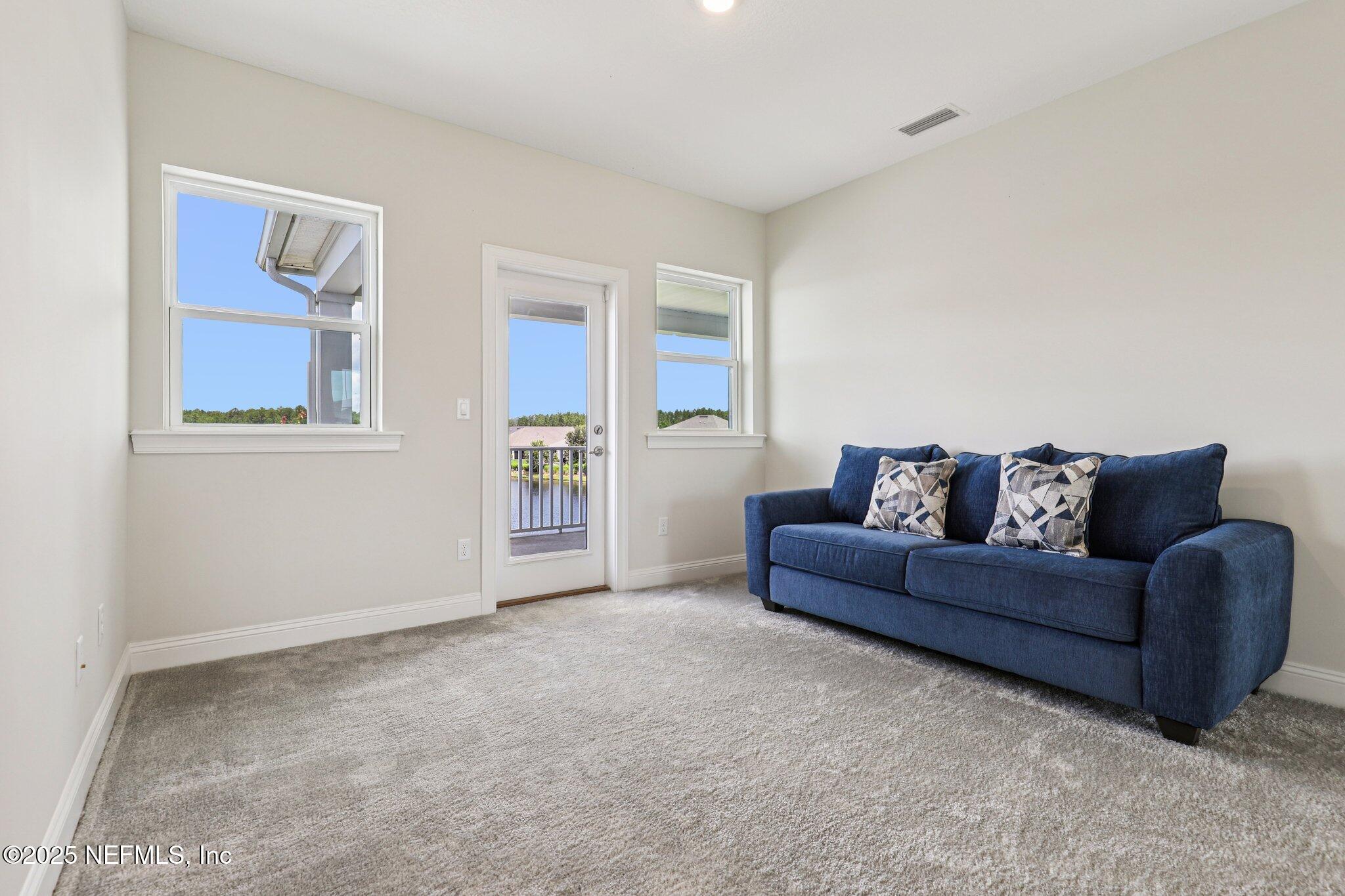 194 Snowbell Court St. Augustine, FL 32095 - Photo 37 of 89 a living room with furniture and a window
