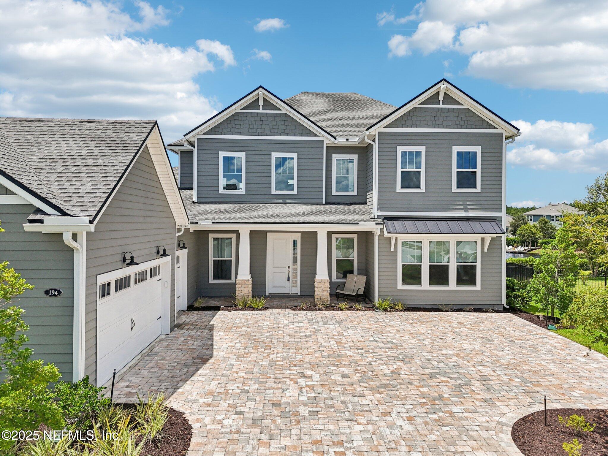 194 Snowbell Court St. Augustine, FL 32095 - Photo 49 of 89 front view of a house with a yard