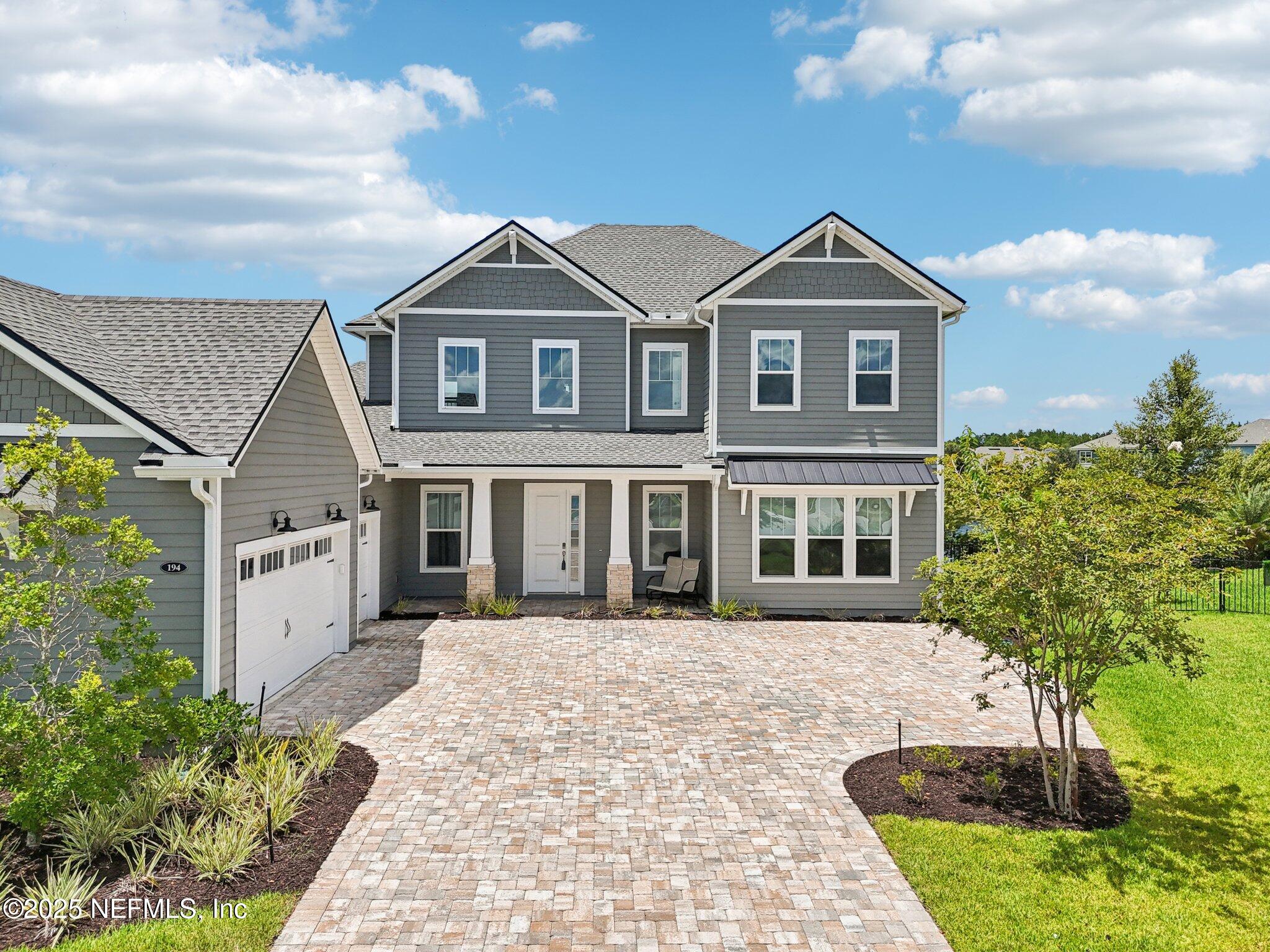 194 Snowbell Court St. Augustine, FL 32095 - Photo 50 of 89 a front view of a house with a yard