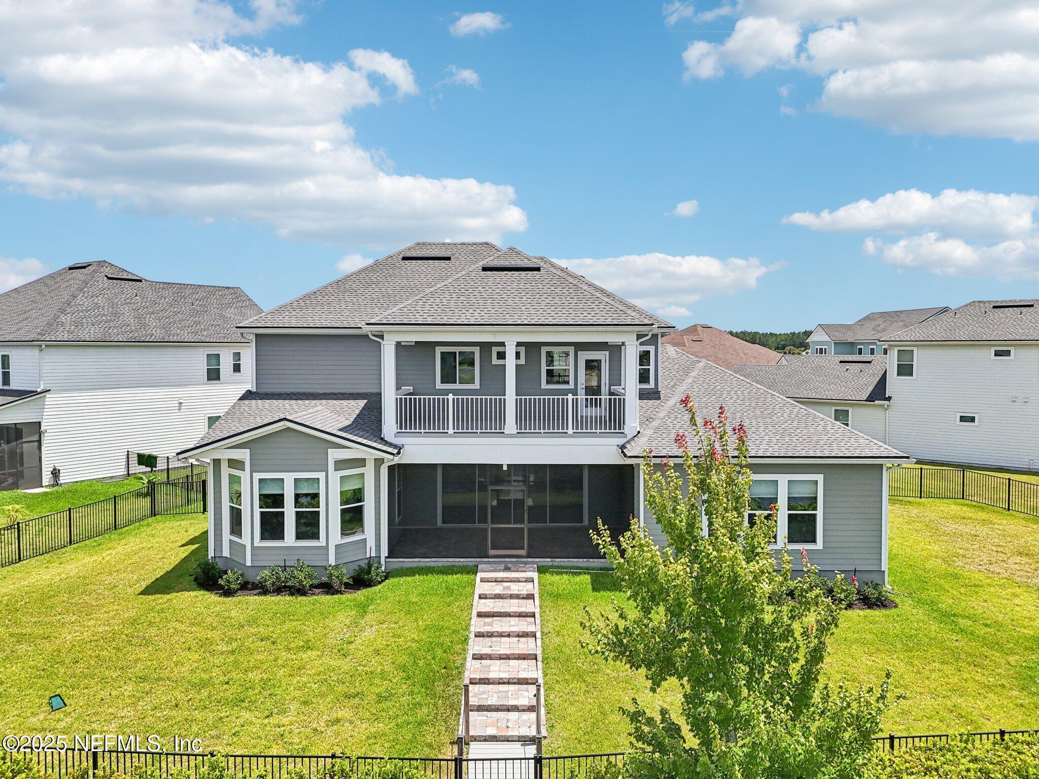 194 Snowbell Court St. Augustine, FL 32095 - Photo 57 of 89 a front view of a house with a yard