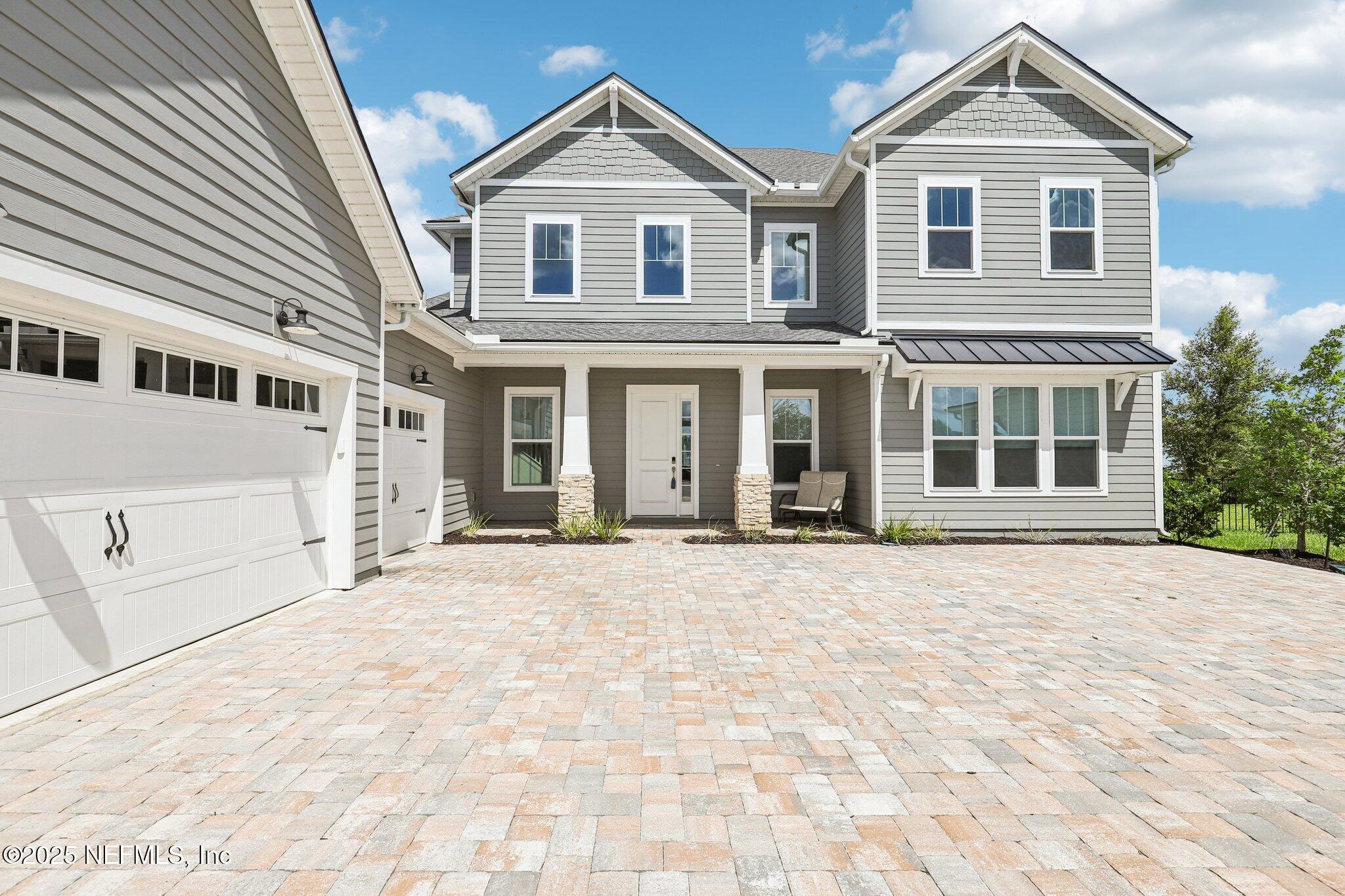 194 Snowbell Court St. Augustine, FL 32095 - Photo 7 of 89 a front view of a house with a yard