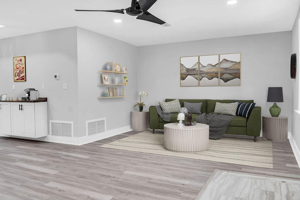 5742 Mt Olive Road Crestview, FL 32539 - Photo 12 of 59 a living room with furniture and wooden floor