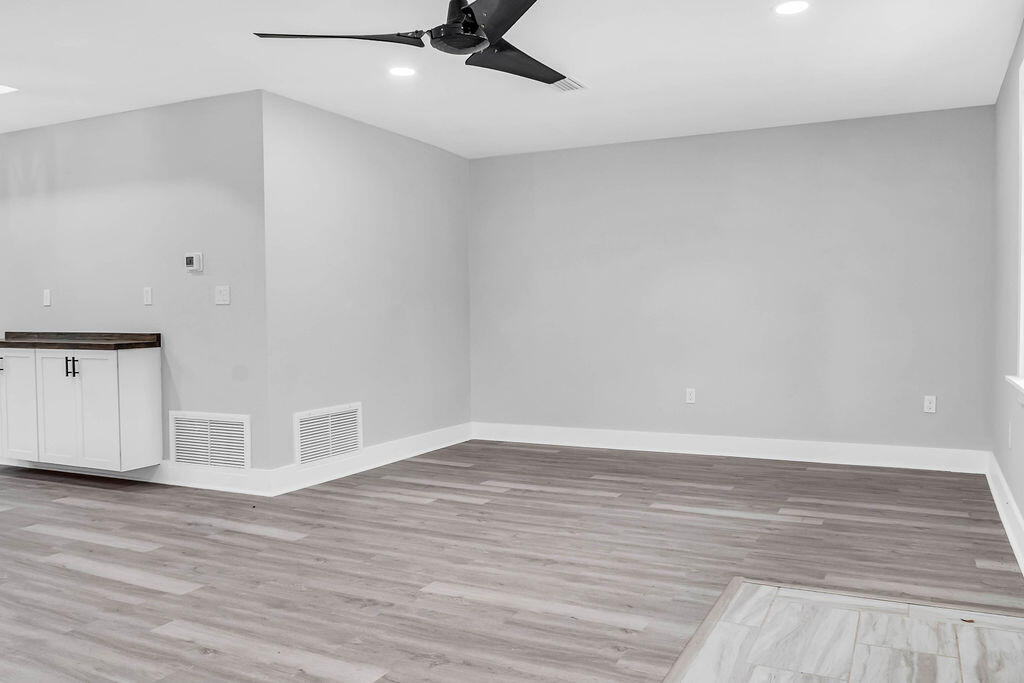 5742 Mt Olive Road Crestview, FL 32539 - Photo 13 of 59 a view of an empty room with wooden floor