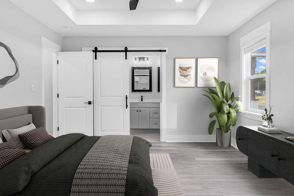 5742 Mt Olive Road Crestview, FL 32539 - Photo 18 of 59 a bedroom with a bed and a couch