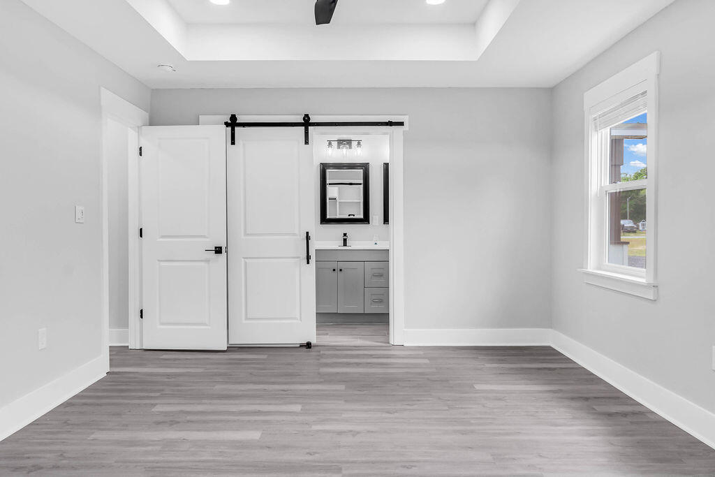 5742 Mt Olive Road Crestview, FL 32539 - Photo 19 of 59 a view of a hallway with wooden floor and closet