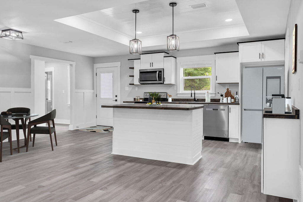 5742 Mt Olive Road Crestview, FL 32539 - Photo 2 of 59 a kitchen with kitchen island granite countertop a sink a counter top space stainless steel appliances and cabinets
