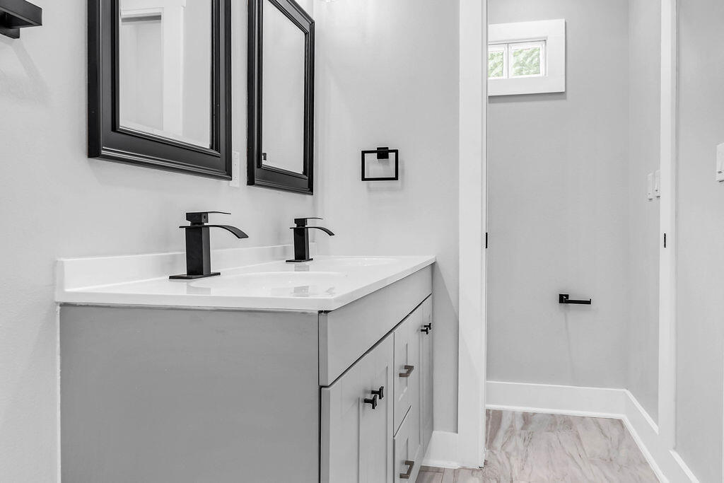 5742 Mt Olive Road Crestview, FL 32539 - Photo 21 of 59 a bathroom with a sink and a mirror