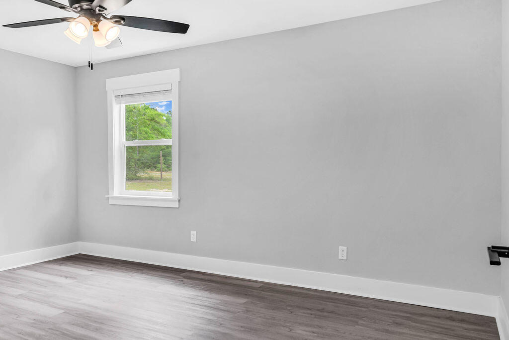 5742 Mt Olive Road Crestview, FL 32539 - Photo 29 of 59 an empty room with a window and a fan