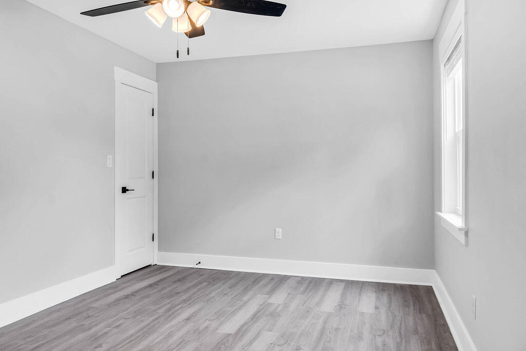 5742 Mt Olive Road Crestview, FL 32539 - Photo 33 of 59 a view of an empty room with wooden floor