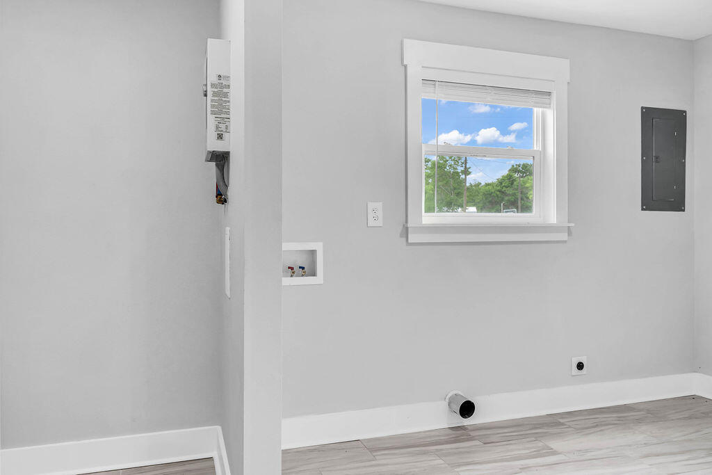 5742 Mt Olive Road Crestview, FL 32539 - Photo 36 of 59 a view of an empty room with wooden floor and closet