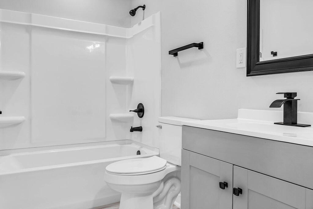 5742 Mt Olive Road Crestview, FL 32539 - Photo 37 of 59 a bathroom with a sink a toilet and shower