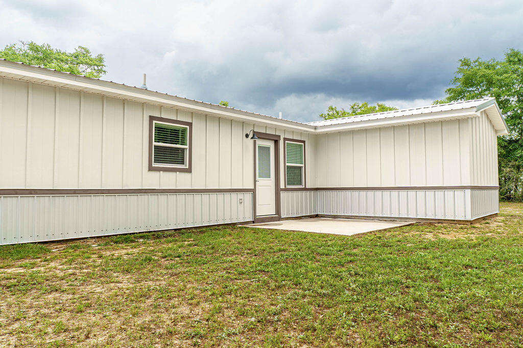 5742 Mt Olive Road Crestview, FL 32539 - Photo 41 of 59 a view of an house with backyard and pool