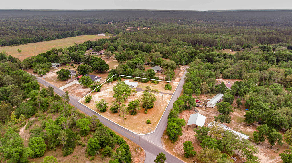 5742 Mt Olive Road Crestview, FL 32539 - Photo 47 of 59 an aerial view of mountain with residential house and ocean view
